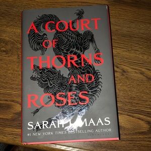 A Court of Thrones and Roses hardcover book
